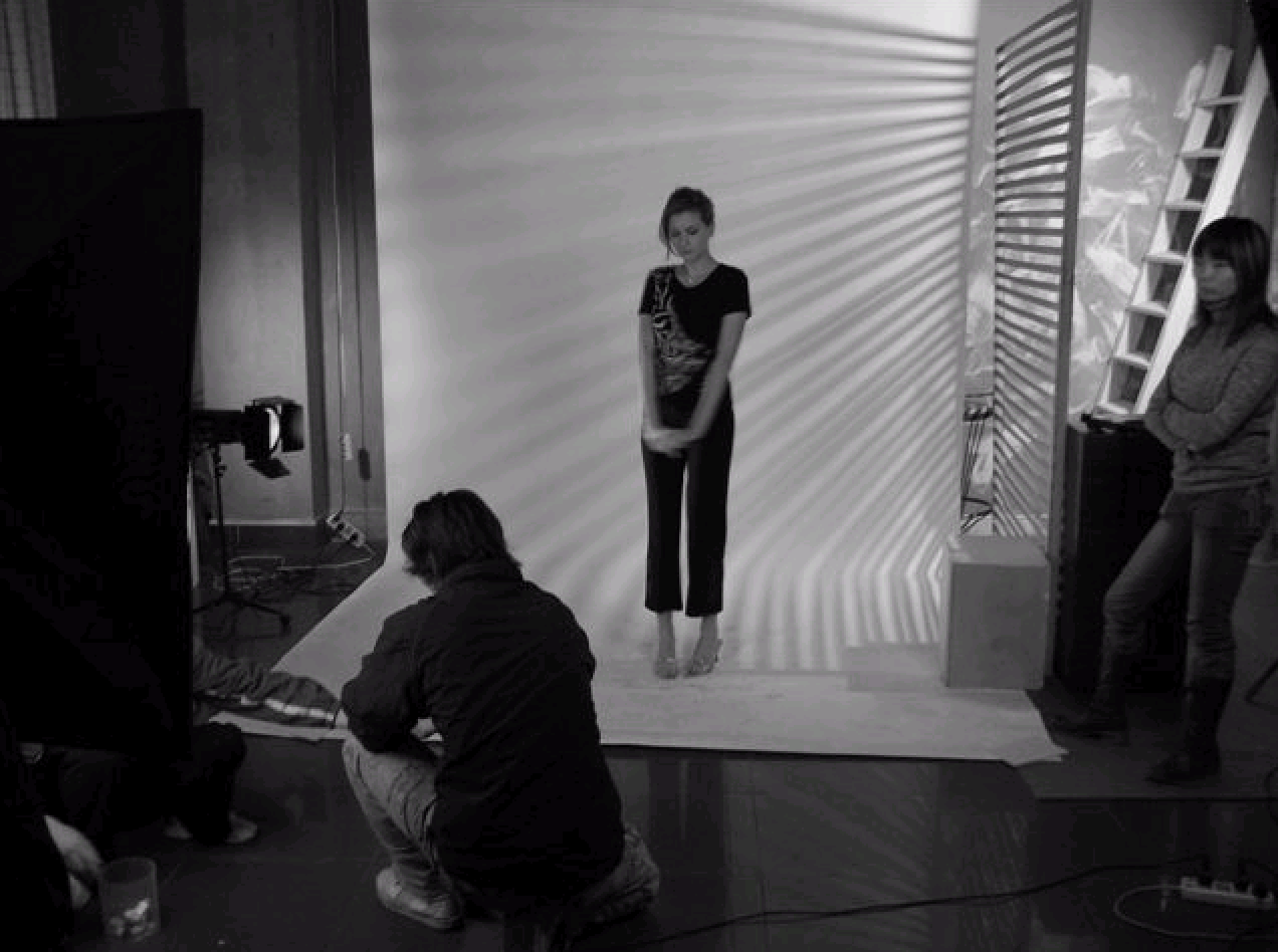 Kelly on set, caught in the quiet tension between takes
