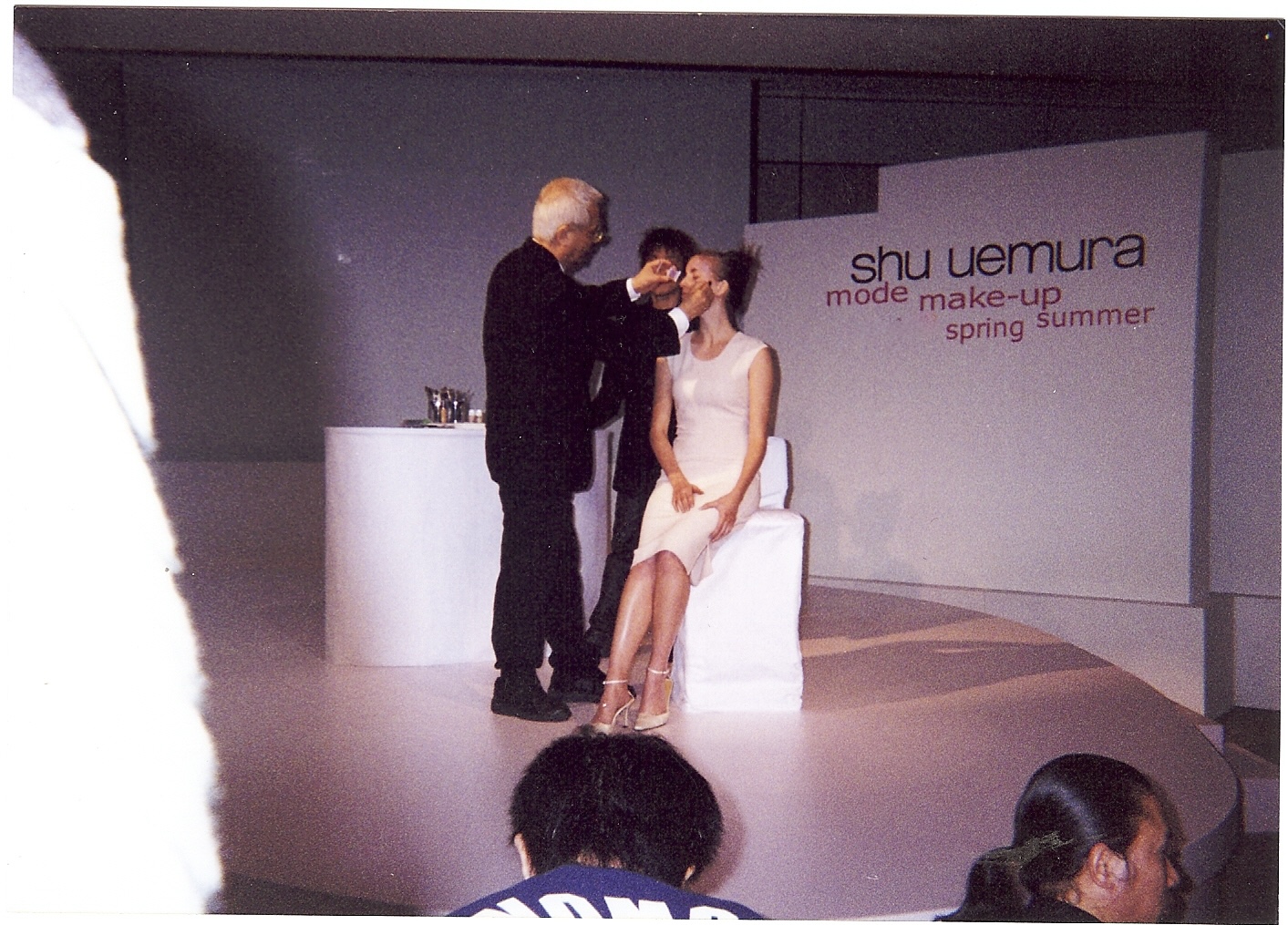 Kelly at a Shu Uemura beauty event, being prepared on stage