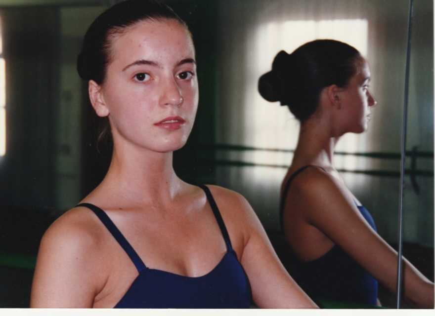 Kelly in a ballet studio, her reflection in the mirror